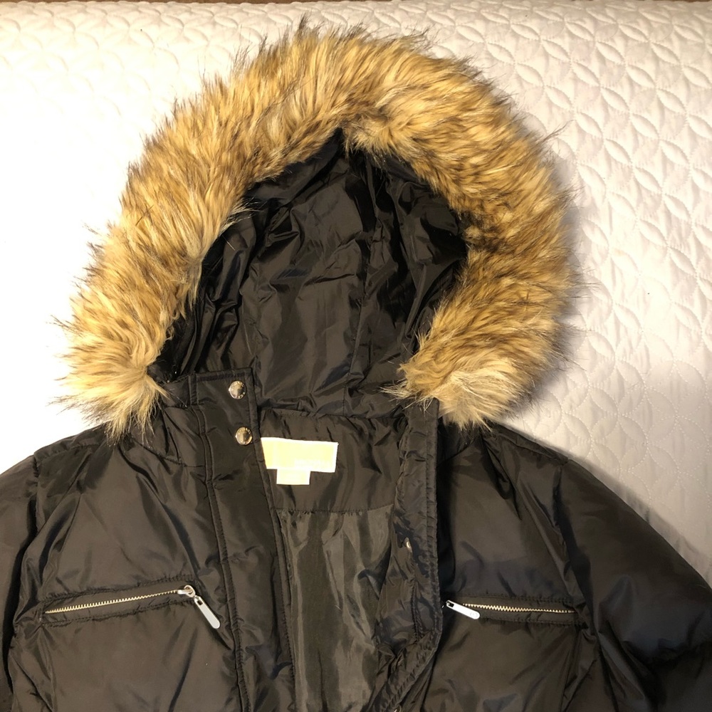 Black, full length parka with fur trimmed hood.